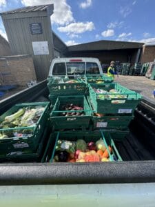 Man unloading fruit and vegetables